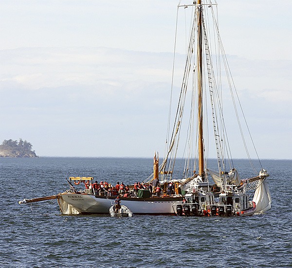 The Coast Guard assists passengers and crew of the 127-foot double-masted charter sailing vessel Zodiac