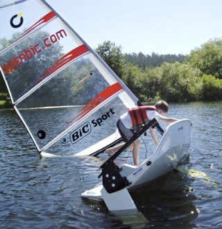 Island Rec sailing student James Nute rights the O’pen Bic in a capsize drill.