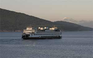 The scene is serene as a ferry shuttles passengers through the San Juans. But not so much in Olympia