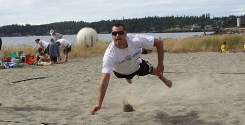 Shawn Kleine dives for the ball at Island Rec’s V-ball  Tournament.