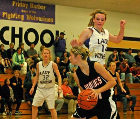 Junior Mandy Turnbull leaps to the Wolverines' defense in Friday Harbor's 50-17 victory over Coupeville