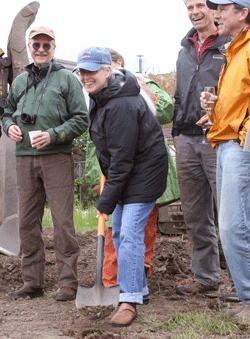 Friday Harbor Mayor Carrie Lacher wields the ceremonial shovel at the Brickworks groundbreaking celebration