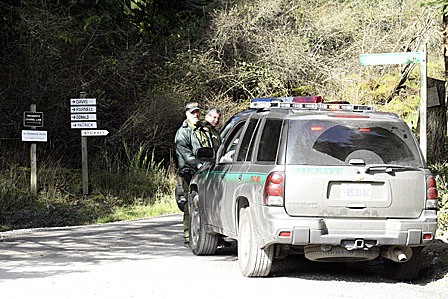 Sheriff's deputies block a road on the west side of Orcas Island