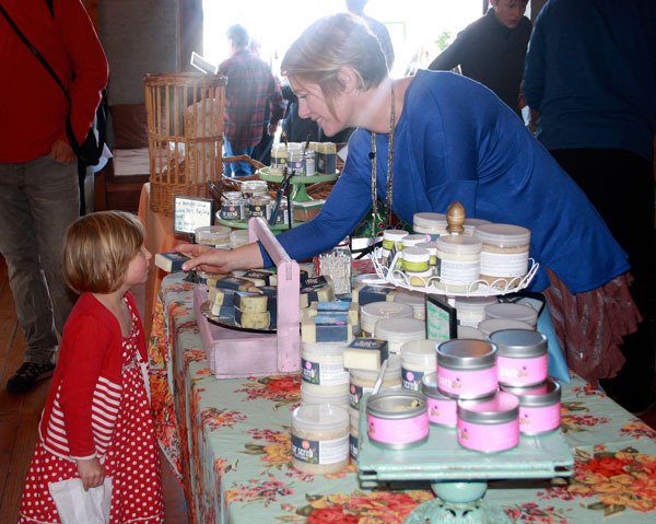 Ashley Dutton of Swallow Song Farm shares a bar of Sugar Bare soap with Aurelia Goodremont