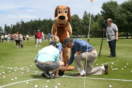 Wags to Riches mascot 'Skipper' monitors the judging at Animal Protection Society first-ever ball drop event