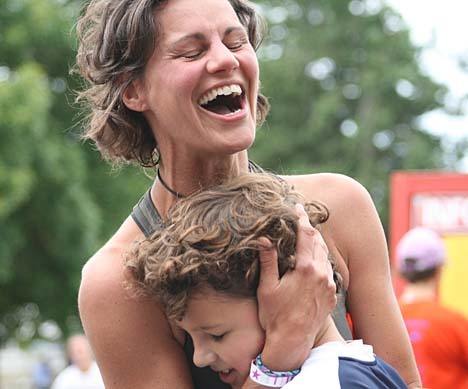 Cameron Clarke gets a big hug at the finish line from fellow Loop runner