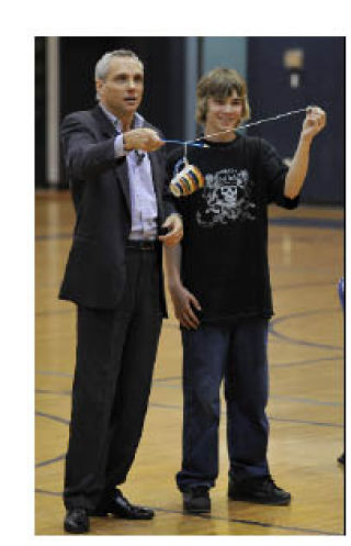 Magician James Warren performs a physics trick with Friday Harbor Middle School serventh-grader Warren Clark. His magic show was mixed with an anti-bullying message.