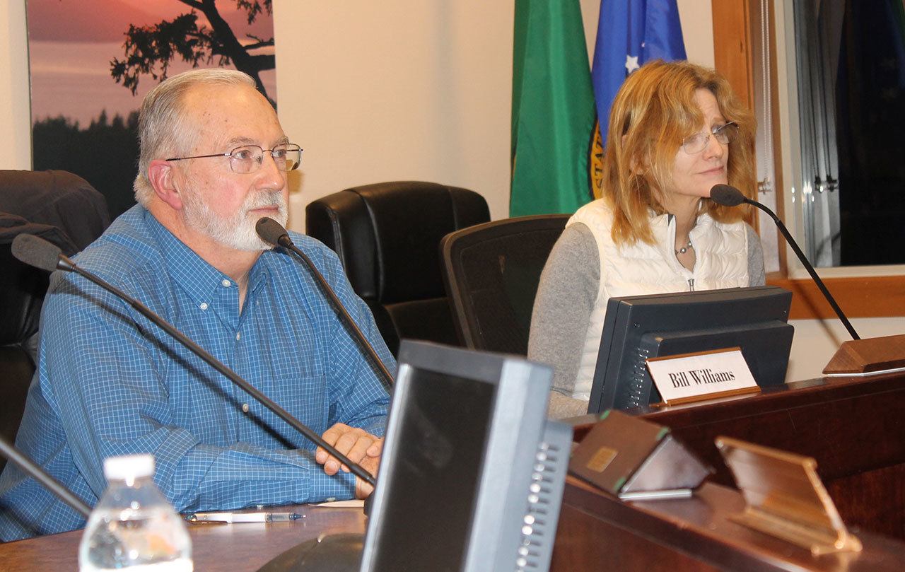 Staff photo/Hayley Day                                Commissioners Bill Williams and Monica Harrington listen at the San Juan County Public Hospital District No. 1 meeting on Dec. 28.