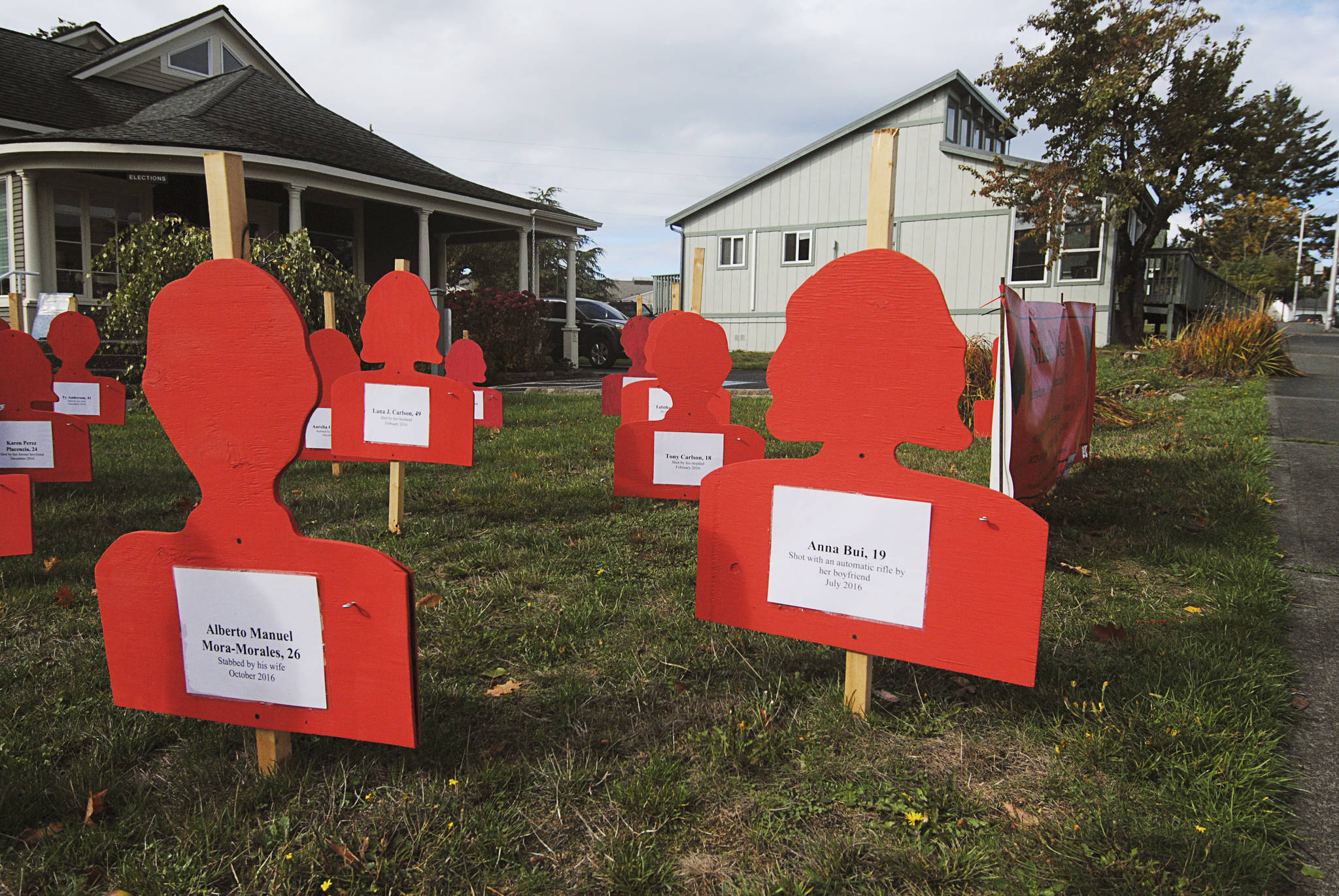 Staff photo/Tate Thomson                                Each red silhouette tells the story of a Washingtonian who passed away from domestic violence in 2016.