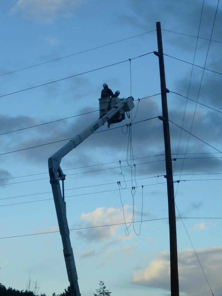 Contributed photo/Scott Brooks                                OPALCO linemen worked about 20 hours to restore power outages on Sunday, Nov. 26 after 55 mph winds hit San Juan County.