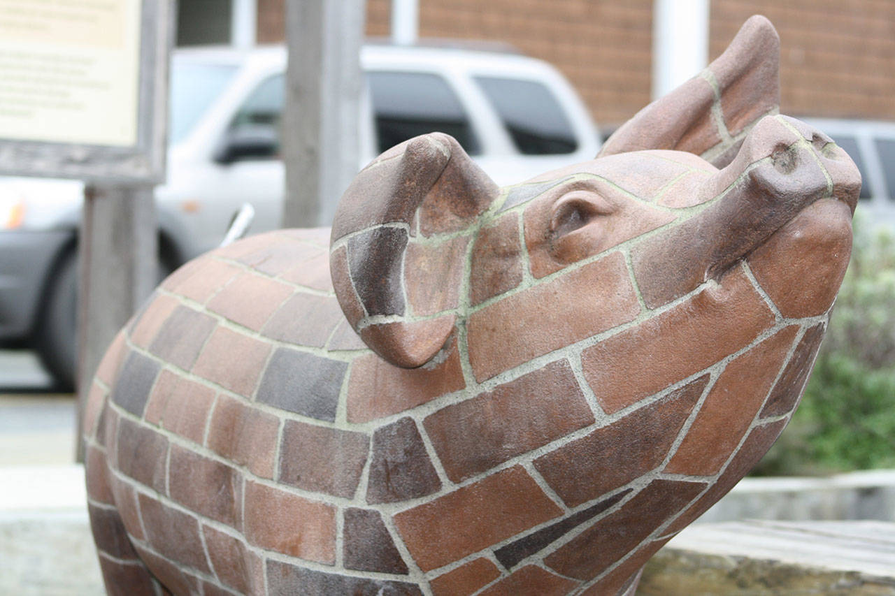 Staff photo/Hayley Day                                The pig sculpture outside of Brickworks collects donations for the San Juan Islands Agricultural Guild.