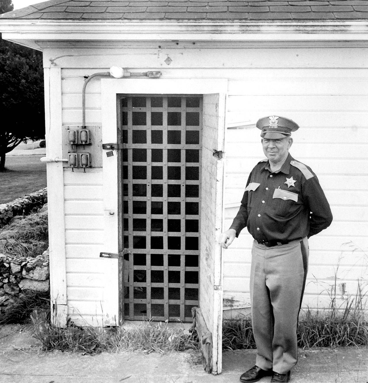 Contributed photo/Jack Carver, Whatcom Museum, Bellingham, Washington                                San Juan County Sheriff Eric Erickson showcases the 1894 jail in July 1968.