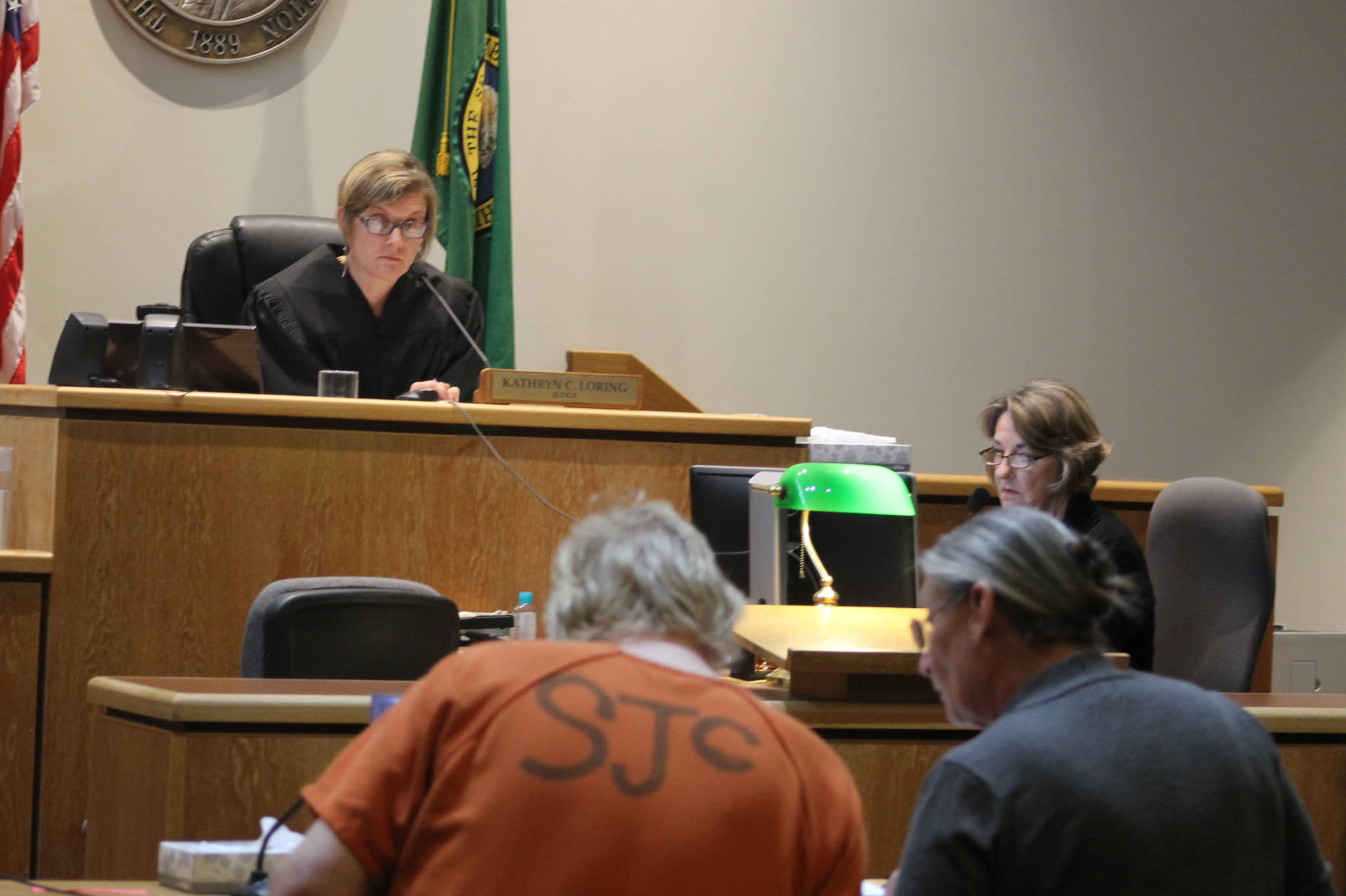 Staff photo Heather Spaulding. Eric Kulp talks with his council, Colleen Kenimond.