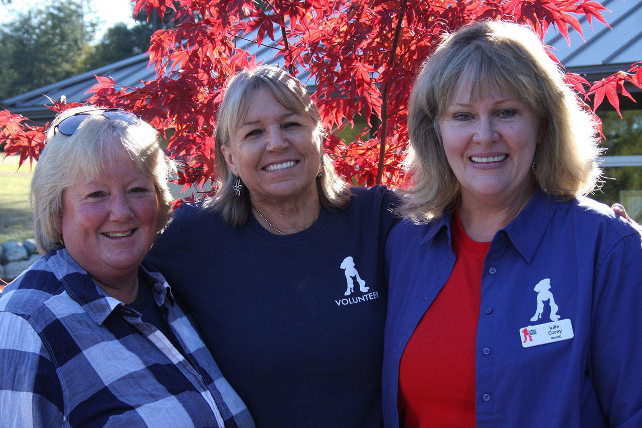 Contributed photo/Tamara Weaver                                Leslie Byron, APS executive director; Jaime Ellsworth, APS Board member; and Julie Corey, APS Board member and past APS Board president celebrate the grand opening on Sept. 29.