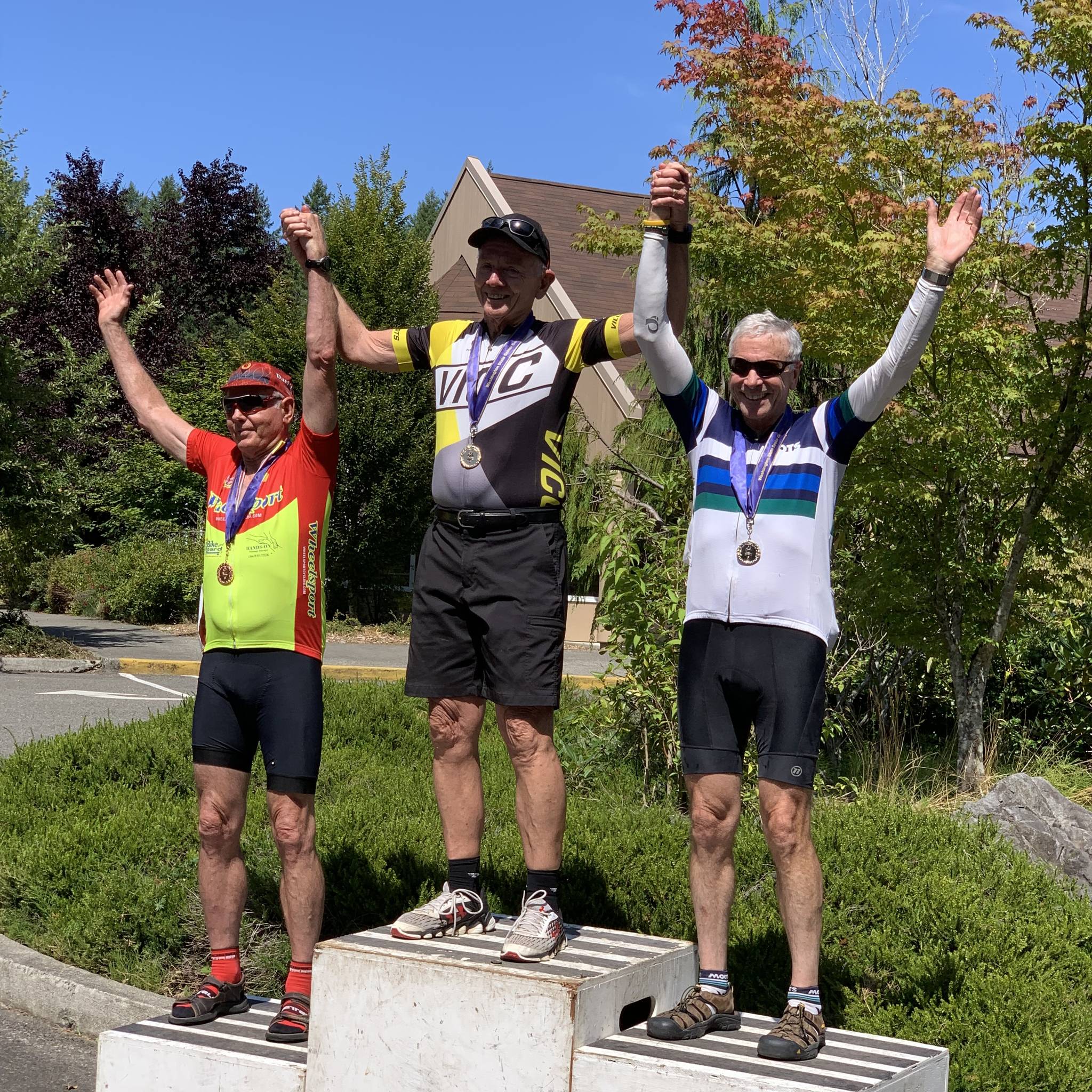 Contributed photo. Medalists receive their awards in Olympia, from right to left: Jerry Nelson, bronze winner, Steve N. Sills, gold winner and Bob Stavers, silver winner.