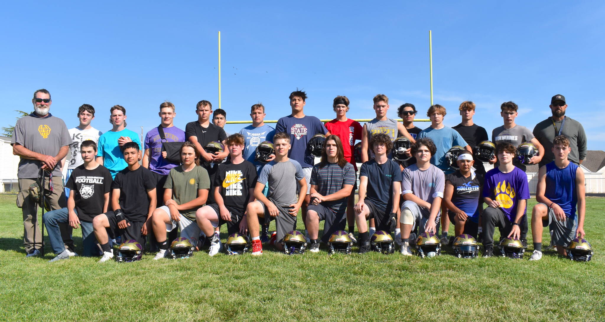 The Friday Harbor Wolverines football team are on the hunt for a fourth title. From left, back row: Coach Shannon Plummer, Kieran Cochran, Nathan Posenjak, Geoffry Volk, Cody Anderson, Victor Velasquez, Tate Geiser, Chris Gustufson, Jaxson Waldron, Max Field, Julio Chavira-Sanabria, Whiley McCutheon, Pierce Kleine, Mason Smith, and Coach Brock Hauck. Front row, from left:  Atreyu Welty, Ronnie Olmos, Jackson Feliz, Ryan Rautenburg, Nick Chambers, Auden Garner, Jackson Martinez, Andy Quiroz, Triston Bremer, and Landon Weidmaier.