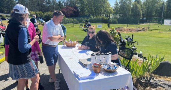 Contributed photo
Heritage Bank volunteers check in players at the Golf Fore! Scholarships.