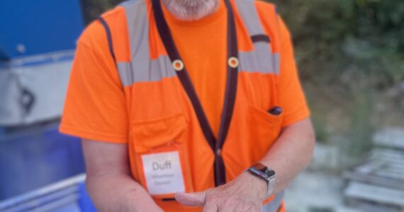 Colleen Smith Summers photo.
ORS board treasurer Jim ‘Duff’ Duffield showing some of the crushed glass, which can be used in landscapes and gardens.