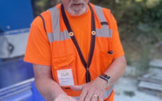 Colleen Smith Summers photo.
ORS board treasurer Jim ‘Duff’ Duffield showing some of the crushed glass, which can be used in landscapes and gardens.