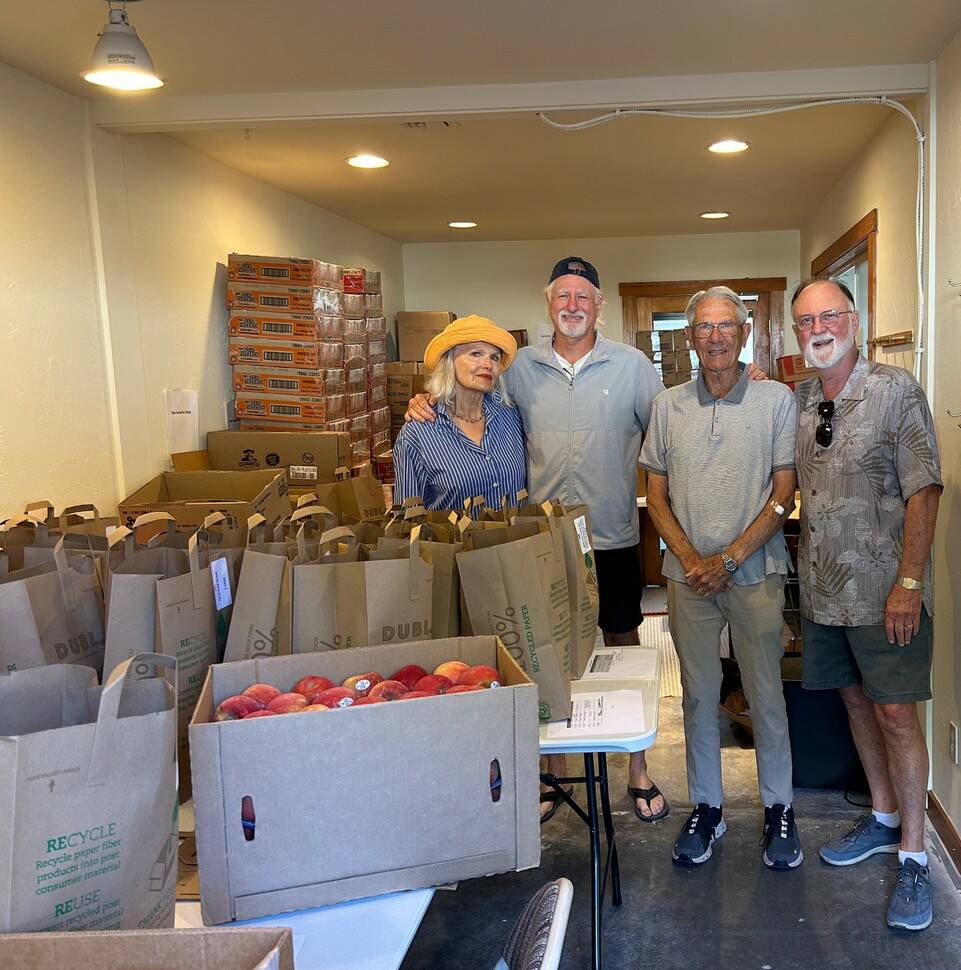 Contributed photo
Carla Wright, Paul Mayer, Dick Shorett and Steve Bowman packing food for 36 Weekends.