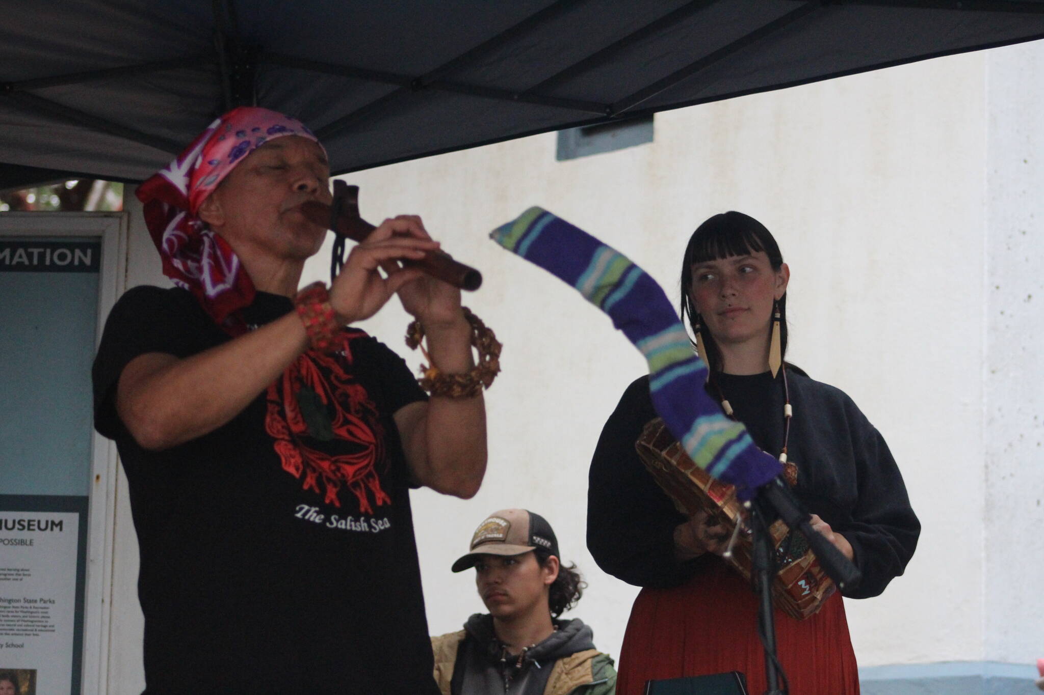 Heather Spaulding Staff photo
Chiyokten Paul Wagner and family member playing flute and drums.