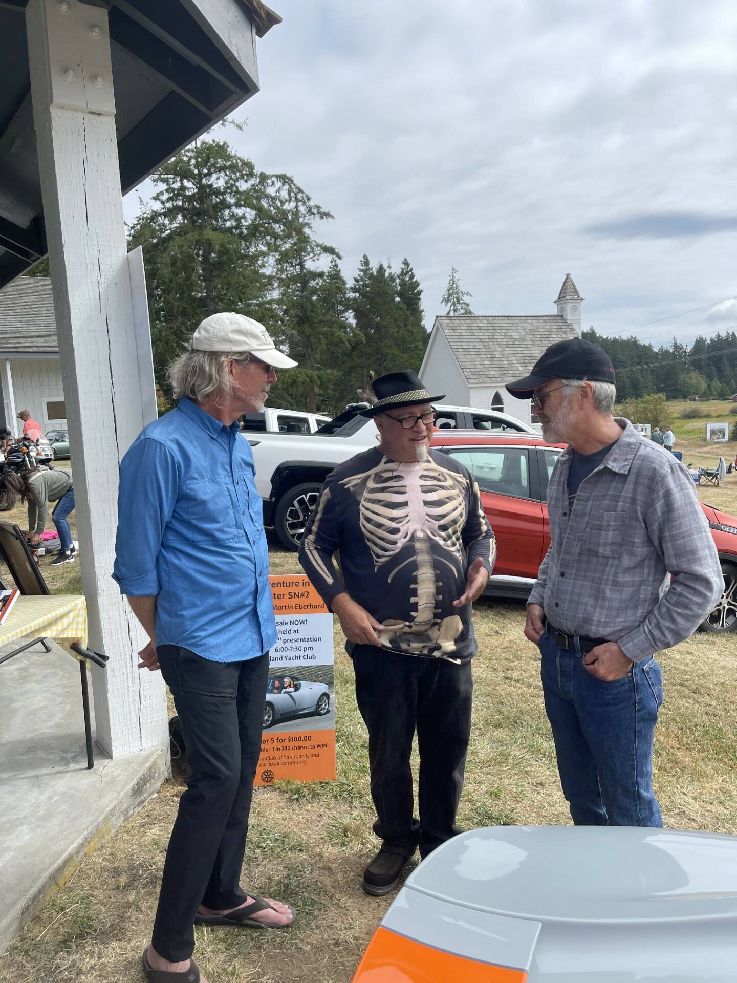 Contributed photo
Judges Jim Clark and Mike Bloom confer with Tesla Founder Martin Eberhard.