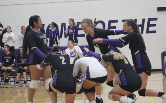 Heather Spaulding Staff photo
Wolverines’ Volleyball players bow down to one of their power servers, Ruby Tapia.