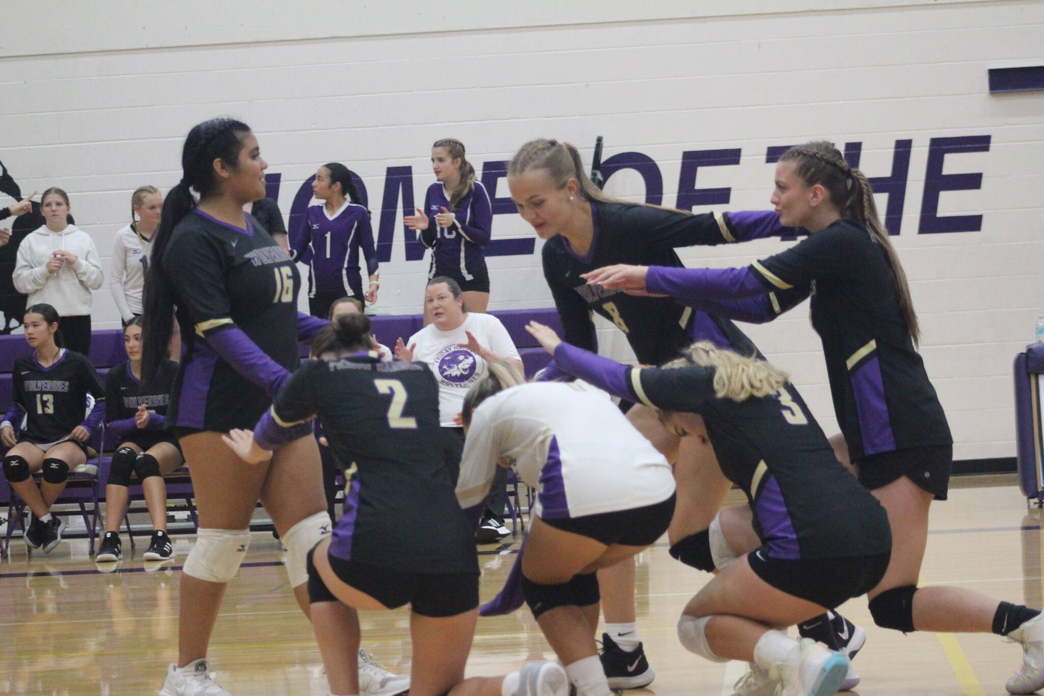 Heather Spaulding Staff photo
Wolverines’ Volleyball players bow down to one of their power servers, Ruby Tapia.