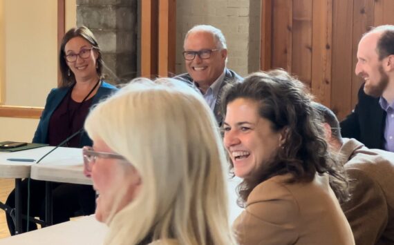 Contributed photo by Jeff Noedel at San Juan Today
San Juan County Council Chair Jane Fuller and Gov. Jay Inslee are all smiles at additional funding for local transportation.