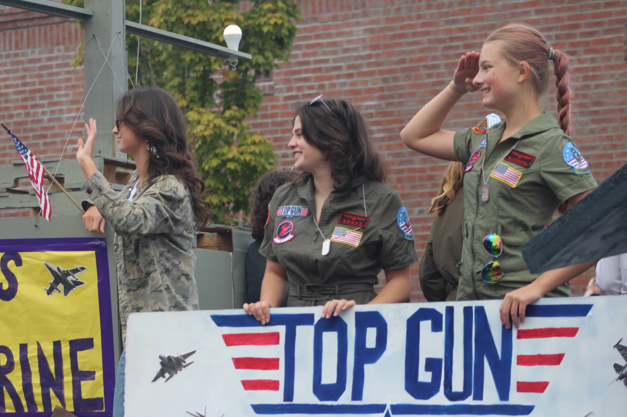 Heather Spaulding Staff photo
Seniors hold up their Top Gun banner on their float.