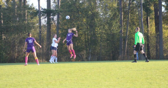 Contributed photos by Robert Rainier Spaulding
The Wolverines get control of the ball via head shot Oct. 24.