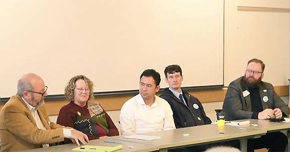 Contributed photo by Jeff Noedel and San Juans Today
Panelists from left: San Juan County Council Chair Jane Fuller, MM&P Vice President Daniel Twohig, Island County Commissioner Janet St. Clair, State Rep. Clyde Shavers (Whidbey Island), State Rep. Greg Nance (Bainbridge Island), State Senator Marko Llias (Edmonds-Mukilteo), and State Representative Emily Alvarado (West Seattle-Vashon).