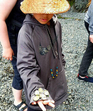 Contributed photo by Erin Licata.
A participant in the Madrona Institute’s Coast Salish Youth Stewardship Corps while on a Canoe Journey through the San Juan Islands.