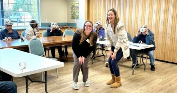 Friends of the San Juans staff, Katherine Dietzman, shoreline and mapping specialist (left) and
Jess Newley, community science and education director (right) with members of the Mullis Community Senior
Center as they embarked on an incredible underwater journey through the Salish Sea using virtual reality
headsets.