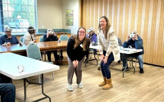 Friends of the San Juans staff, Katherine Dietzman, shoreline and mapping specialist (left) and
Jess Newley, community science and education director (right) with members of the Mullis Community Senior
Center as they embarked on an incredible underwater journey through the Salish Sea using virtual reality
headsets.